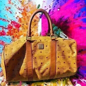 MCM cognac  monogram XL vintage duffle travel bag- this lady has been loved- COA